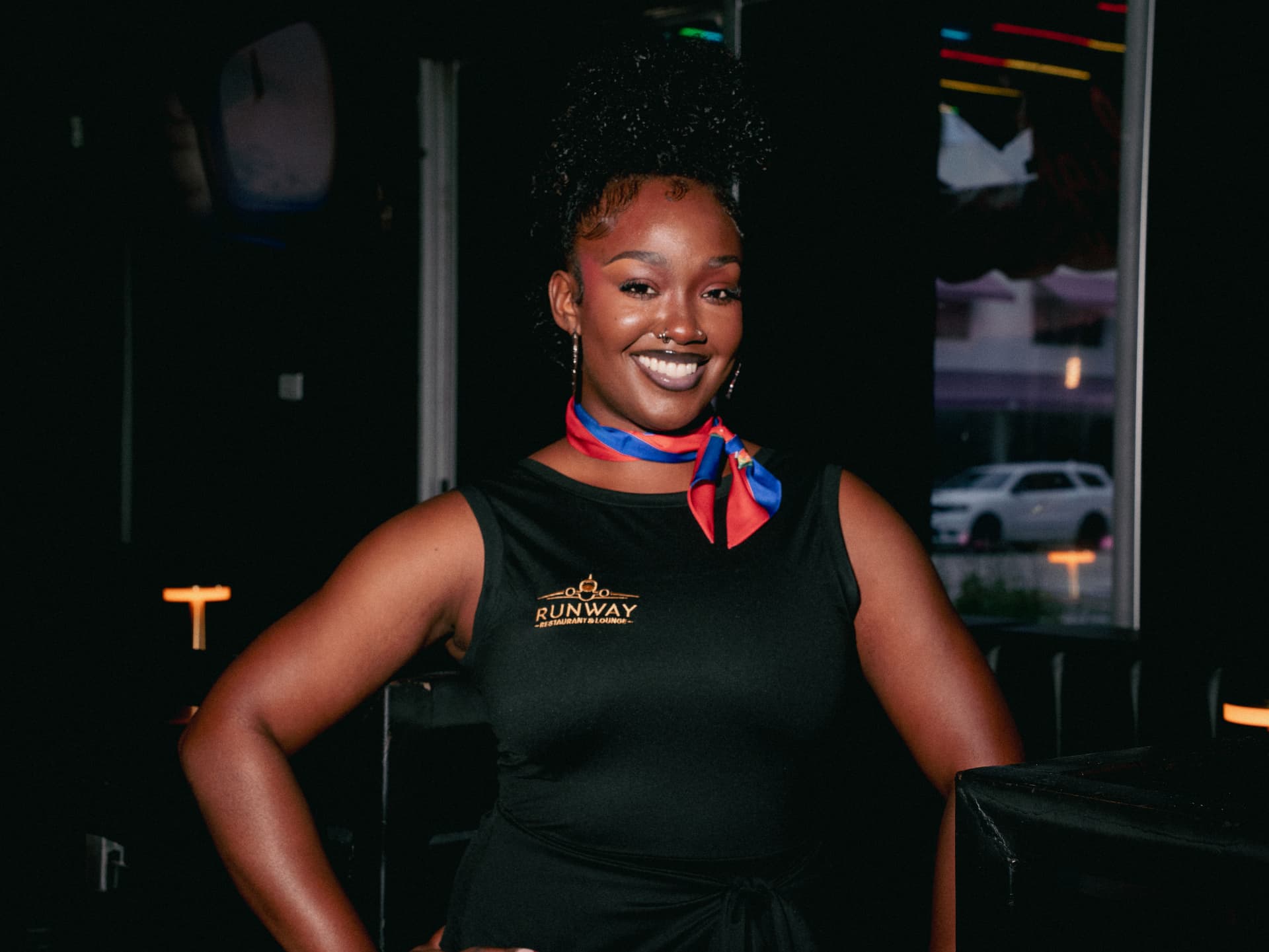 A Runway stewardess in her nation's colors